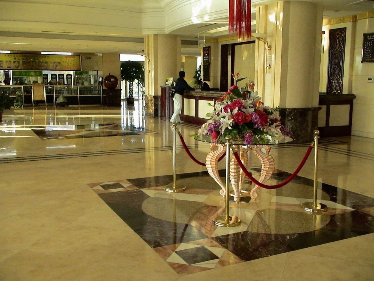 Event coordinator walking a couple through the conference hall